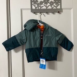 6-12 month old size - Columbia dinosaur jacket - color green